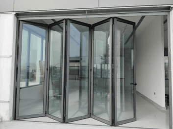 Folding bi-fold aluminum door open to a terrace